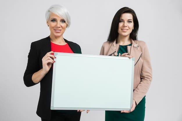 Two professional women in their late 20s are depicted in a panel from a josei manga. They are sitting at a table in a modern office, discussing a project with serious expressions. The art style is detailed and realistic, highlighting their facial expressions and professional attire.