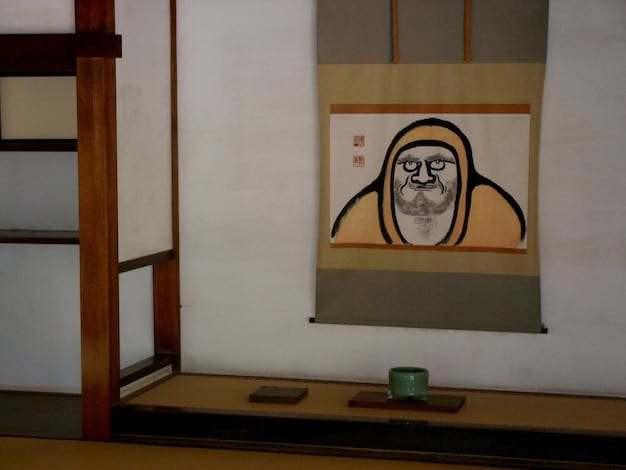 A panel showcasing Katsura's detailed art style from Is manga. The panel features a close-up of Isa Takanashi, with her expressive eyes and delicate features meticulously rendered. Her hair flows gracefully, and subtle shading highlights her facial contours. The background is softly blurred, drawing attention to her emotional expression. The artwork exemplifies Katsura's ability to convey depth and emotion through his intricate character designs.